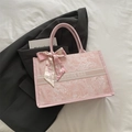 Pink canvas tote bag with silk scarf ribbon and Fashion Bag text on grey blazer - Pink