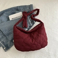 Burgundy heart-quilted tote bag with stylish knot strap design for 2024 fashion - Red