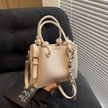 Litchi pattern cream bucket bag with unique knot handle and woven charm pendant - 20x16x9cm / Khaki