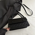 Black leather plaid woven handbag with dual decorative round buckles and long shoulder strap - Black