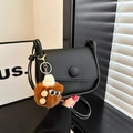 Black leather saddle bag with round buckle and cute plush monster charm detail - With Ornament / Black