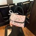 Pink heart-print mini crossbody bag with black trim and a decorative pearl chain - Heart / With Charm