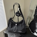 Black nylon crescent shoulder bag with white drawstring detail and mini coin pouch accessory - Black