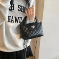 Quilted black handbag with heart metal clasp and silver chain strap for women - Black