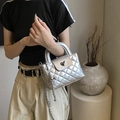 Silver quilted chain bag for women with metallic finish and heart-shaped twist lock - Silver