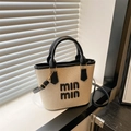 Sac seau en paille beige avec garniture en cuir noir et anses courtes - Noir