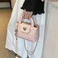 Pink quilted crossbody bag with heart lock and chain strap for stylish women - Pink