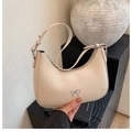Minimalist apricot half-moon shoulder bag featuring a silver metal bow buckle detail - Glaze Apricot