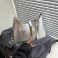 Minimalist silver underarm bag with glossy pearl finish and gold chain detail - Silver
