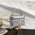 Silver quilted vanity bag with metal chain strap and top handle for women - Silver