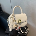 Chic cream white PU leather square handbag with golden buckle and braided charm - White