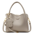 Minimalist off-white pebbled leather bucket bag with top handle and puppy charm detail - Off White