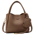 Brown lychee leather handbag with dual handles and a cute dog charm attachment - Khaki