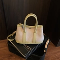 Canvas and light green leather bucket bag with top handle and adjustable strap - Green