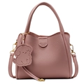 Pink lychee grain leather bucket bag with top handle and puppy charm accessory - Pink