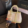 Canvas bucket tote bag with light green leather trim and a cute denim teddy bear charm - Green with Bear Pendant