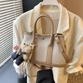 Beige canvas bucket bag with brown leather trim and a cute plush bear charm decoration - Khaki With Bear Charm