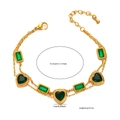 Detailed view of double-layered gold bracelet with green heart and square zircons - Double Layer Heart and Square Style / Gold-Green Zirconia