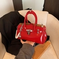 Red patent leather handbag with silver lock and pearl charm chain on neutral background - Without Pendant / Red