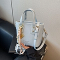 Light blue mini leather bucket bag with top handle and adjustable shoulder strap - Charm / Blue