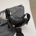Glossy black croissant shoulder bag with quilted details and silver grommet strap - Black