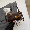 Classic dark brown glossy leather handbag with golden buckle and sleek detachable strap - Coffee