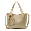 Chic cream white pebble leather bucket bag with dog charm and fashion text detail - Yellow