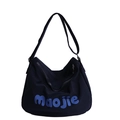 Black canvas tote bag for school or commute with blue Maojie print and adjustable strap - Dark Blue