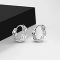Macro detail of silver liquid metal style hoop earrings with wavy texture on grey background - Silver Liquid Metal Wave Huggie (EH761YS)