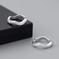 Detailed view of silver wave-shaped earrings with textured frosted and polished finish - Silver Wave Irregular Frosted Huggie (EH762YS)
