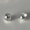 Detailed view of spherical silver earrings with starburst engraving and central crystal - Starburst Zirconia Silver (DDTE429YS)