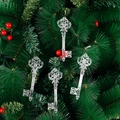 Clear vintage engraved Christmas tree key ornaments hanging on green pine branches - Transparent Snowflake Pendant