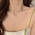 Close-up of rose gold double-layered four-leaf clover necklace with cubic zirconia - Rose Gold Double Layer Clover Necklace (DD-TN76-silver)