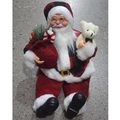 Kerstman beeldje met rood geblokte muts, cadeauzakje en witte pluche teddybeer - Hars Zittende Kerstman Rood