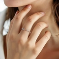 Detailed view of an irregular butterfly ring with rectangle zircon and white pearl - Pearl Zirconia Style