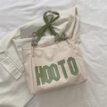 Beige tote bag with green HOOTO lettering and leather strap with silver chain details - Green