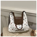 Dettaglio di una borsa tote bianca con pois colorati e finiture in pelle marrone - Bianco senza ciondolo