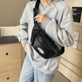 Minimalist black synthetic leather chest bag for women with adjustable nylon strap - Black
