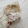 Beige quilted crossbody bag with red contrast stitching and wide woven shoulder strap - White