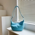 Sky blue crescent nylon crossbody bag with adjustable strap and grid texture - Blue
