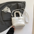 Quilted down crossbody bucket bag in pearl white glossy finish with padded texture - White
