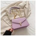 Light purple woven crossbody bag with gold hardware and elegant metal chain strap - Purple