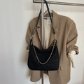 Black suede hobo shoulder bag with gold chain strap on professional office outfit - Black without Pendant
