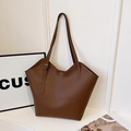 Brown lychee leather tote bag with unique wave edge design and thin shoulder straps - Brown