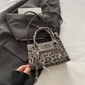 Fashionable leopard print faux leather handbag with shoulder strap and silver hardware - Black