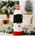 Close-up of snowman wine bottle cover with knit stripes and soft plush texture - Snowman