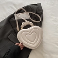 Creamy white heart-shaped handbag with quilted concentric texture and pleated handle - White