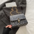 Chic black and grey leopard print crossbody bag with gold chain strap and stylish clasp - Black