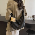 Large black hobo shoulder bag in pebble leather with yellow plush charm for women - Black
