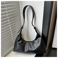 Detail of black suede hobo bag with adjustable strap and artistic shutter light shadows - Black